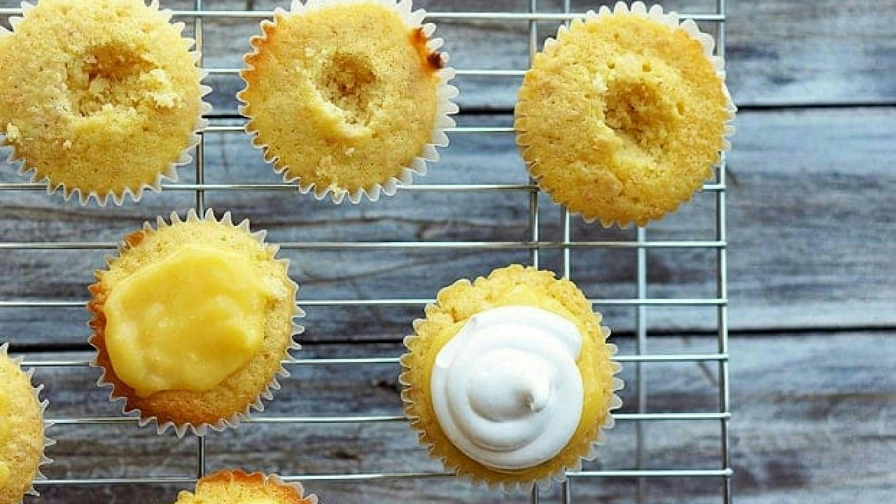 Lemon-Filled Coconut Cupcakes - Foodess Lemon-Filled Coconut Cupcakes - Foodess